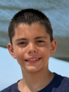 Photo of a smiling boy uploaded by his parent